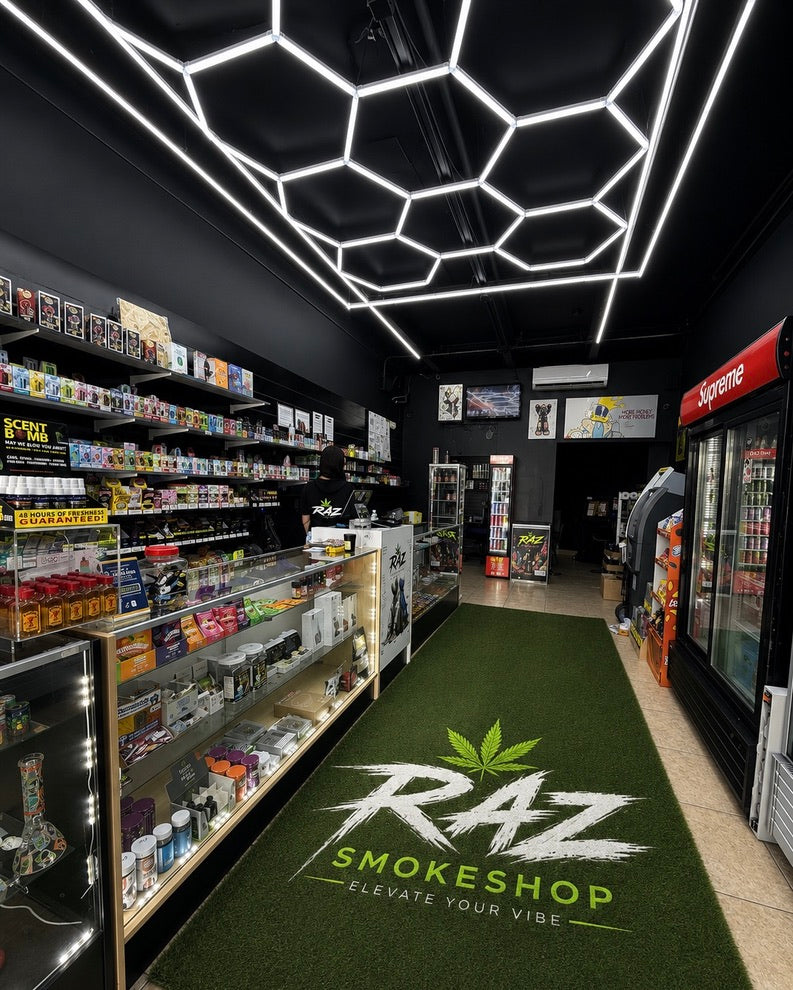 Inside RAZ, with geometric ceiling lights and the branded green floor mat